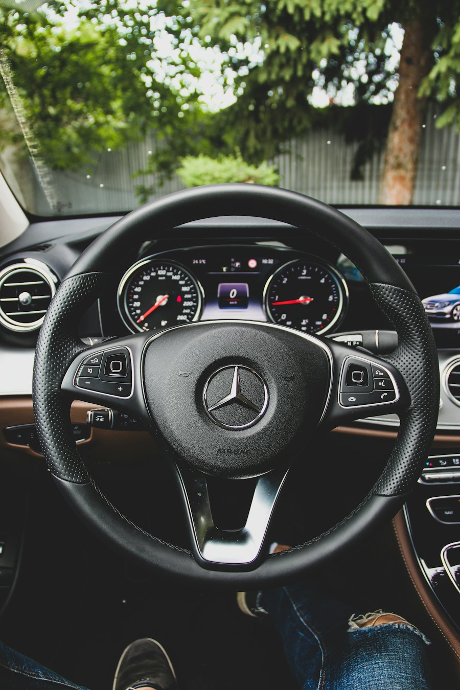 The steering wheel and dashboard of a car
